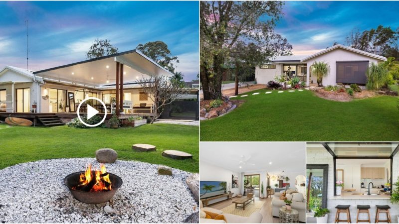 Relax in the lush gardens of this one-story home with this spacious indoor living space.